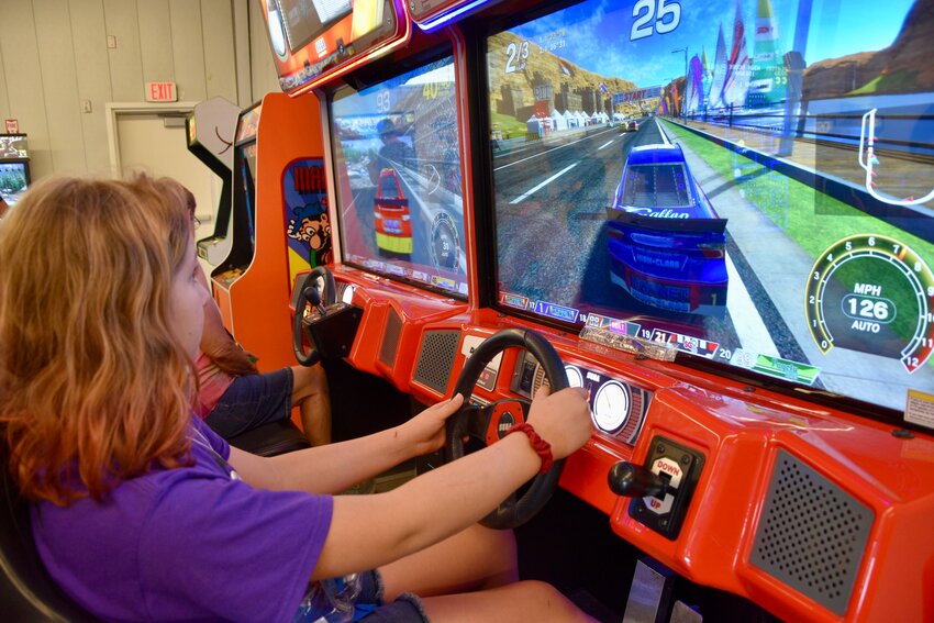 At the arcade, Samatha Ruthburt raced a car in a video game on August 3.